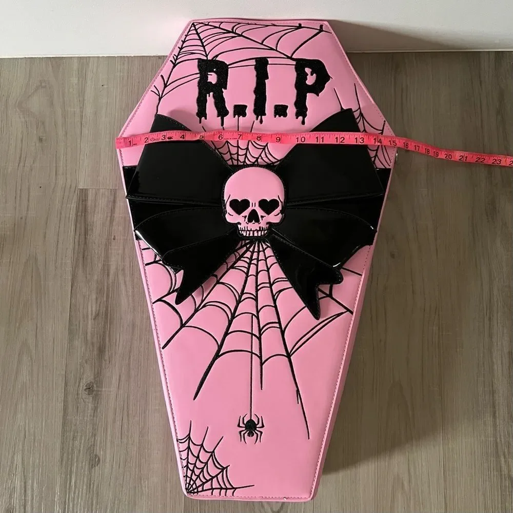 Dolls Kill oversize pink and black skull spiderweb coffin backpack. New in box